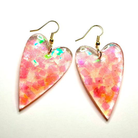 "Cosmic Hearts"   Heart-shaped translucent and iridescent pink resin earrings